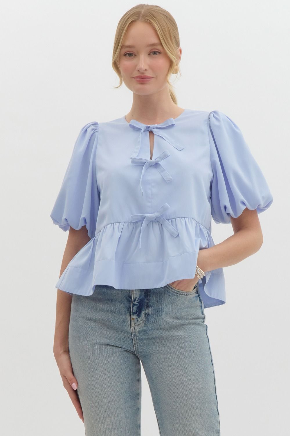 Three Bow Peplum Top